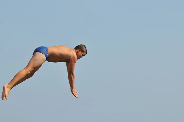 Boy jump sea — Stock Photo, Image