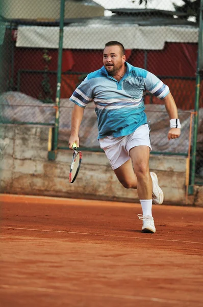 Теніс людини — стокове фото