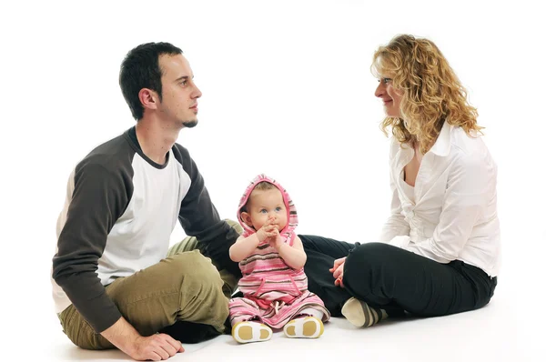 Happy young family together in studio — Stock Photo, Image