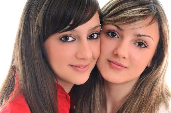 Дві молоді дівчата ізольовані на білому — стокове фото