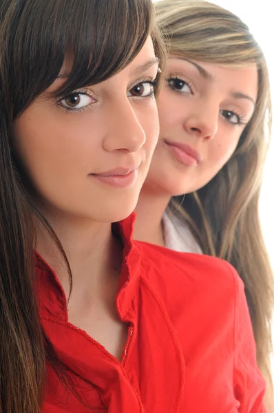 Dvě mladé dívky izolovaných na bílém — Stock fotografie