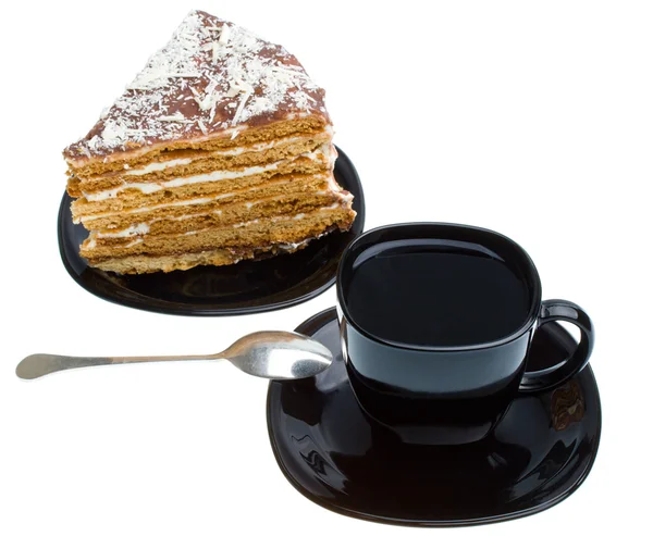 Pedazo de pastel de miel y taza de té — Foto de Stock