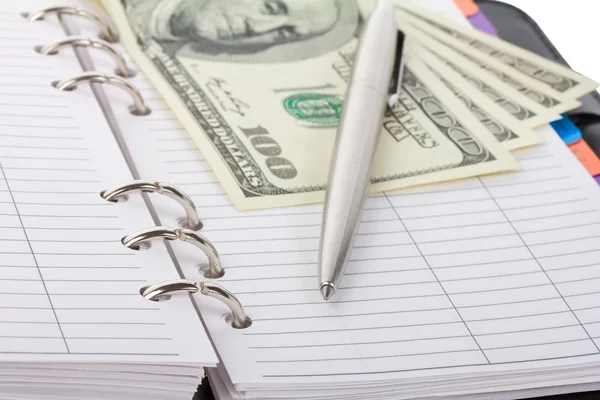 Opened notebook, pen and dollars — Stock Photo, Image