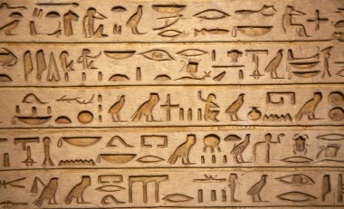 Hieroglyphs carved on the stone clipart