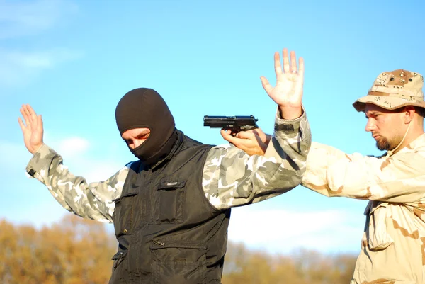 Soldier aiming terrorist — Stock Photo, Image