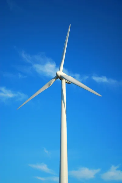 stock image Windmill in Romania gathers energy from the summer breeze.