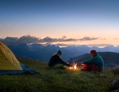 Couple camping at night