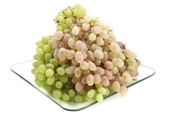 Zöld és rózsaszín szőlő a lemez. — Stock Fotó