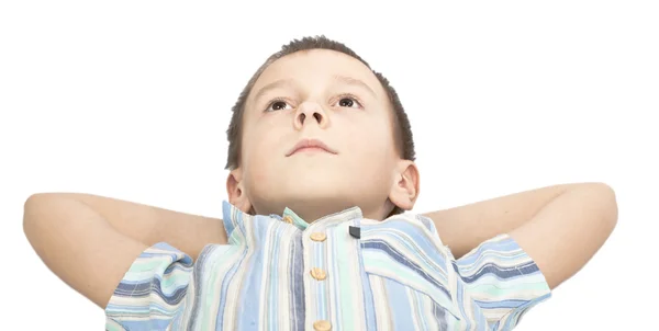 Boy is looking up pensively. — Stock Photo, Image