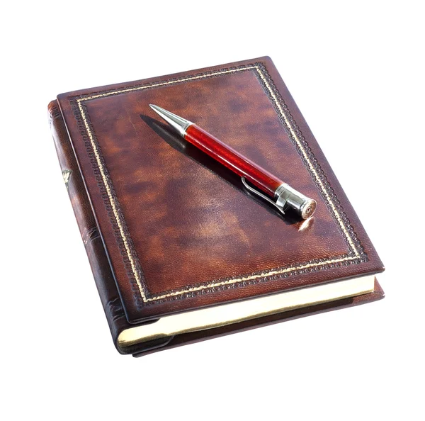 Caderno e caneta vermelha — Fotografia de Stock