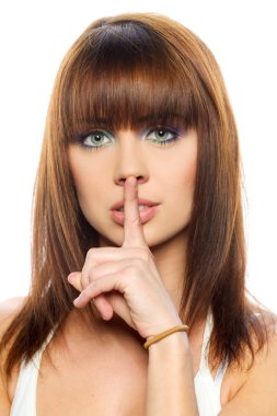 Secret - Young girl with her finger over her mouth clipart