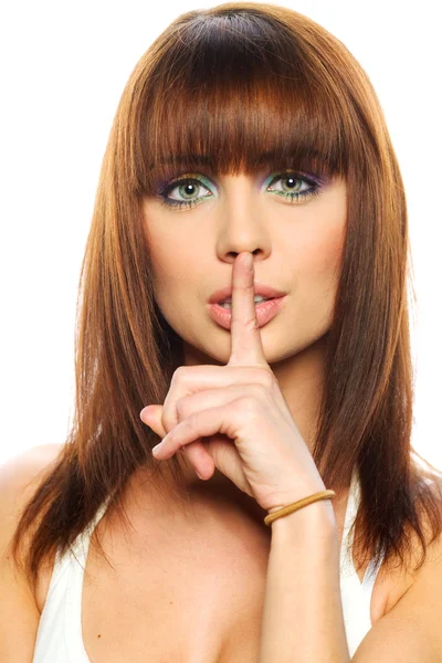 Secret - Young girl with her finger over her mouth — Stock Photo, Image