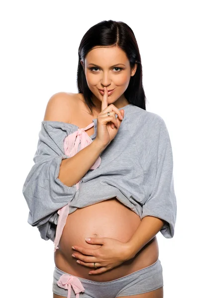 Zwangere vrouw geïsoleerd op witte backgorund — Stockfoto