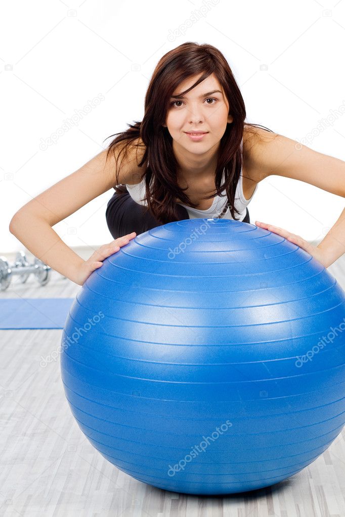 Woman making exercise with fitness ball