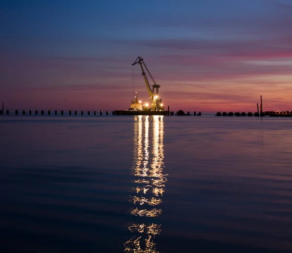 Floating crane at night Stock Picture