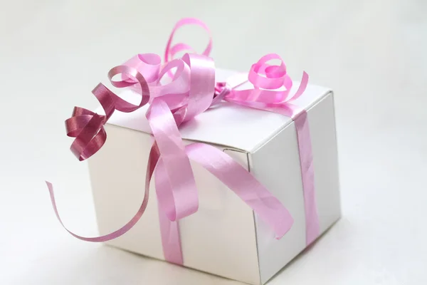 White boxed gift with ribbons — Stock Photo, Image