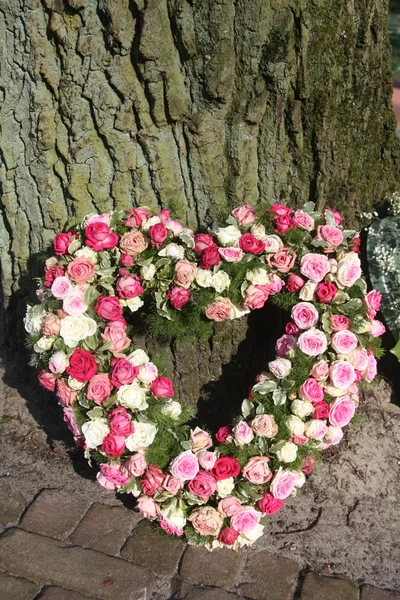 Heart shaped sympathy floral arrangement — Stock Photo, Image