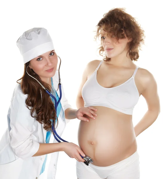 Доктор с беременной женщиной — стоковое фото
