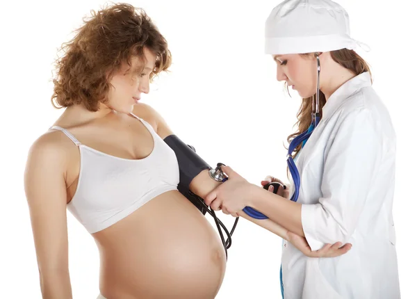 Doktor s těhotnou ženou — Stock fotografie