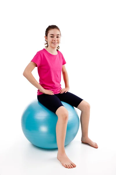 Menina se exercitando no fundo branco — Fotografia de Stock