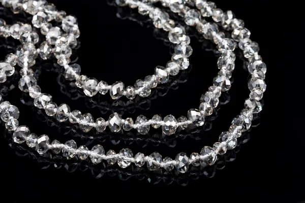 Grânulos com diamantes em preto — Fotografia de Stock