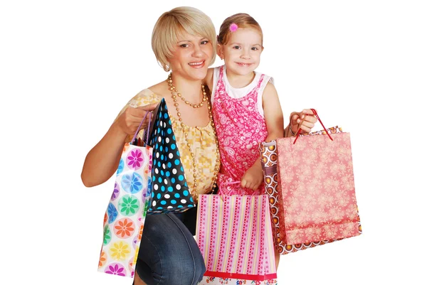 Счастливая мать и дочь с сумками для покупок — стоковое фото