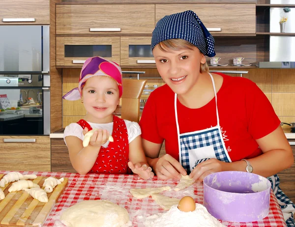 Mother and daughter making rolls — Stock Photo, Image