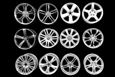 Car wheel aluminum rims isolated on black clipart