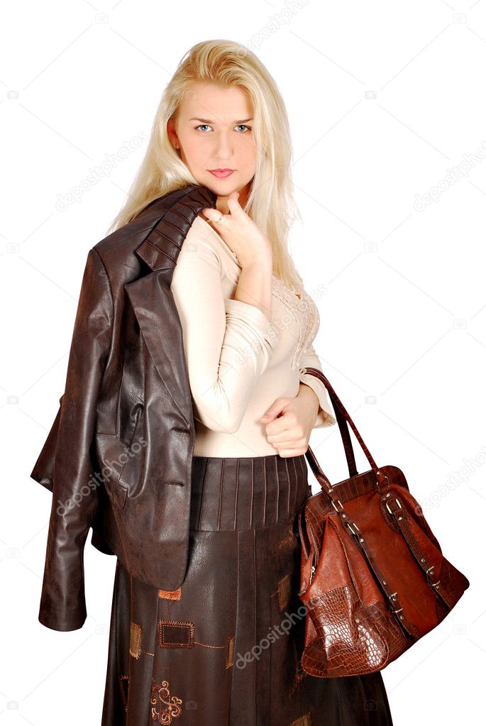 Beautiful woman with leather jacket and bag posing