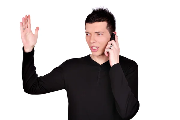 Wściekły młody człowiek rozmawiający przez telefon — Zdjęcie stockowe