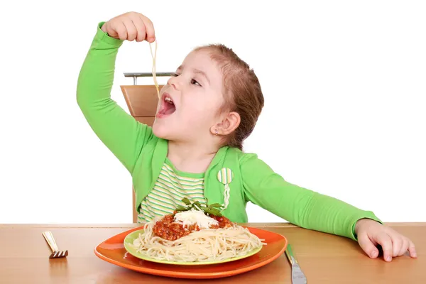 Four years hungry little girl eating spaghetti — Stock Photo, Image
