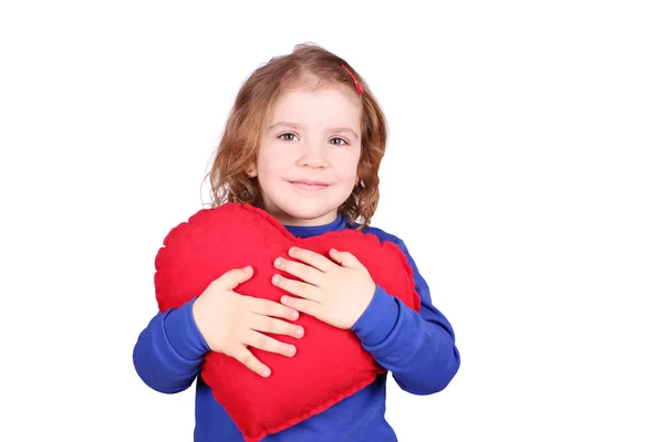 Happy little girl holding red heart — Stock Photo, Image
