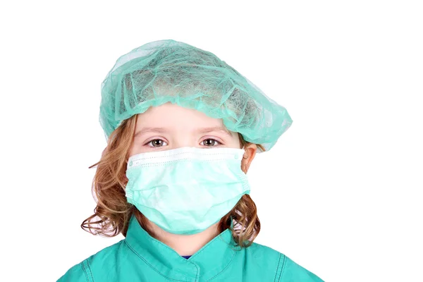 マスクを持つ小さな女の子医師 ストックフォト