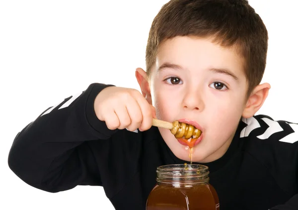 Хлопчик і меду — стокове фото