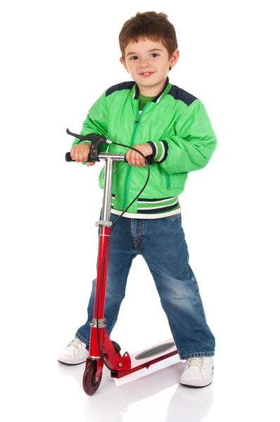 Little boy on the scooter Royalty Free Stock Images