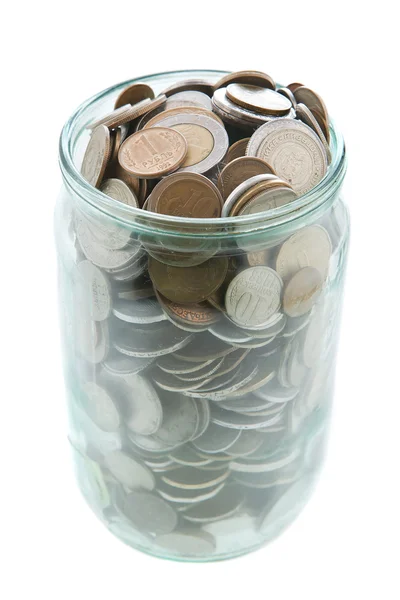 Dinero en frasco de vidrio sobre fondo blanco — Foto de Stock