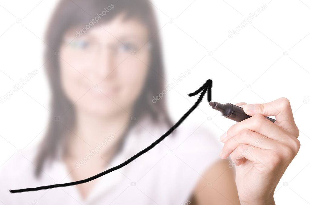 Businesswoman with pen drawing graph