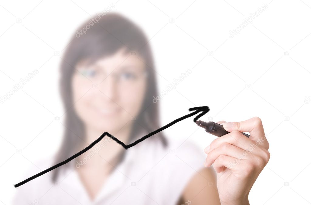 Businesswoman with pen drawing graph