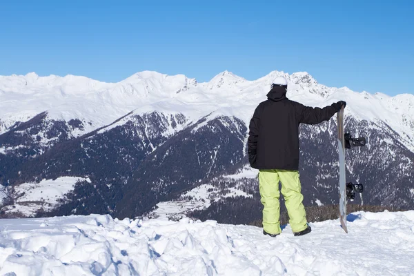 Relaxed Snowboarder Looking High Mountains — Stock Photo, Image