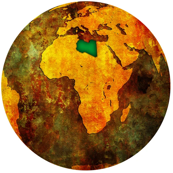Libië vlag op globe kaart — Stockfoto