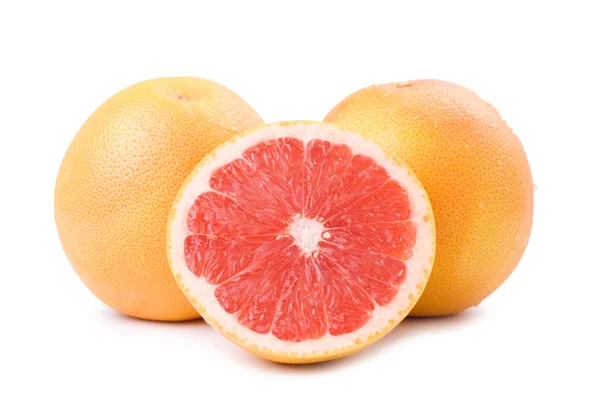 Изолированный спелый грейпфрут и ломтик — стоковое фото