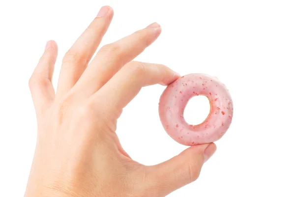 Precioso mini donut en la mano del hombre — Foto de Stock