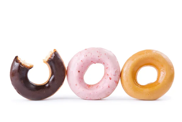 Colorido delicioso donut en una fila —  Fotos de Stock