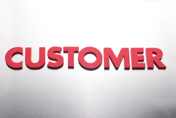 Customer word on metal background, part of a series of business words — Stock Photo, Image