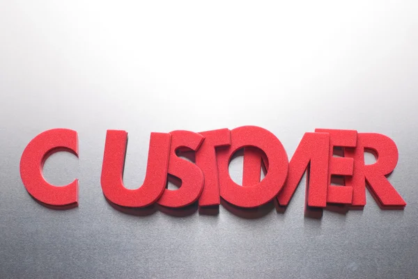 Customer word on metal background, part of a series of business words — Stock Photo, Image