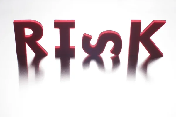 Risk word on metal background, part of a series of business words — Stock Photo, Image