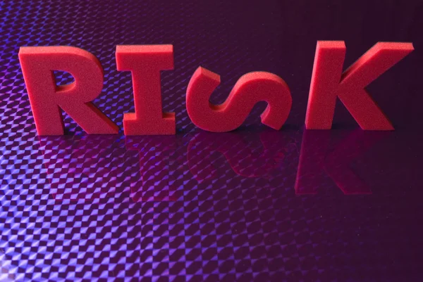 Risk word på blå neon bakgrund — Stockfoto