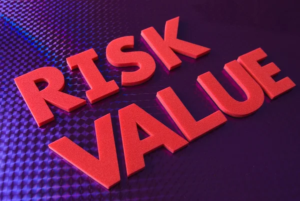 Valore di rischio parola su sfondo blu al neon — Foto Stock