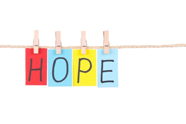 Esperança, palavras coloridas penduradas na corda — Fotografia de Stock