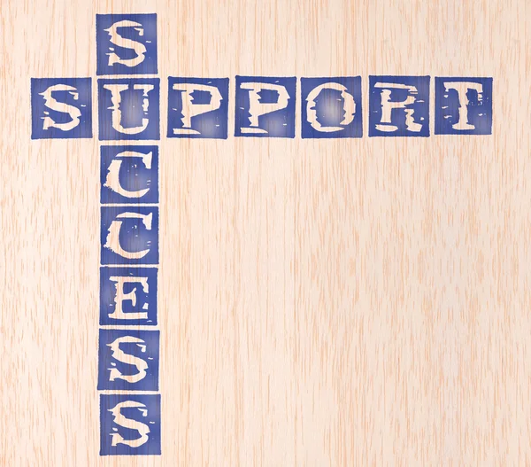 Success and support word stamped on wooden background — Stock Photo, Image